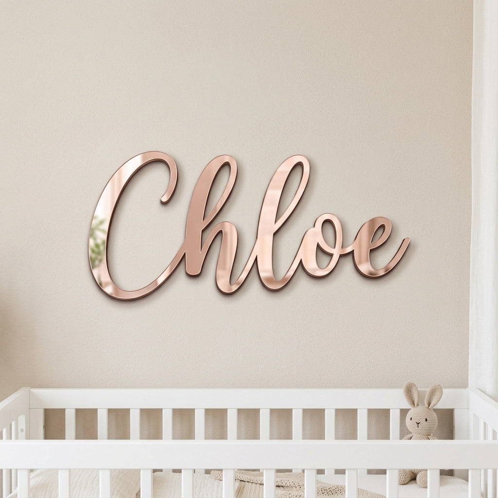 Mirror acrylic name sign on a bedroom wall